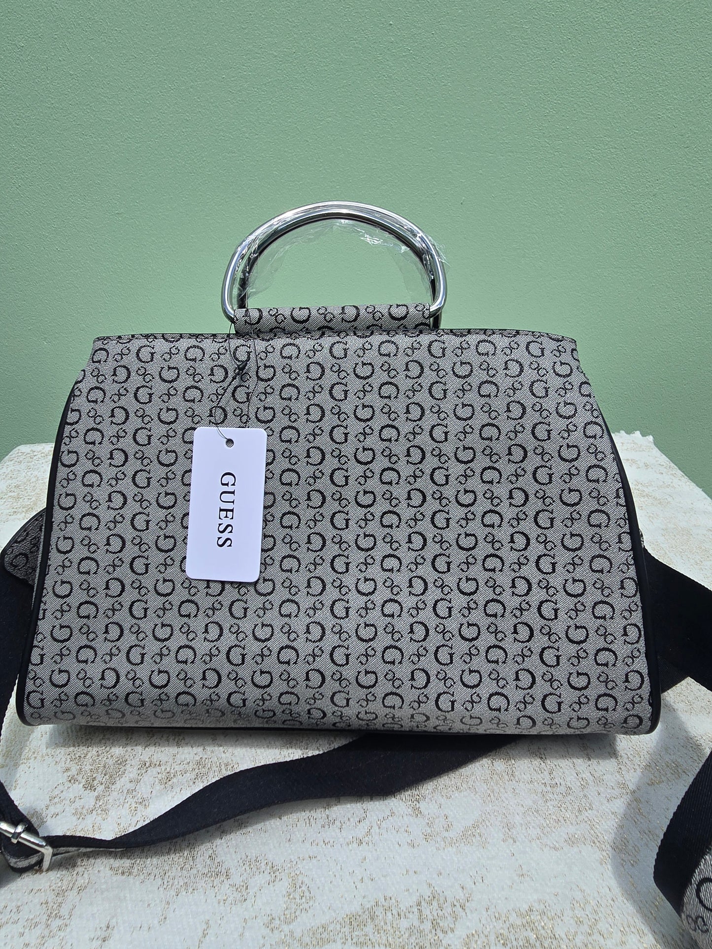 GUESS Satchel with silver metal handle with snap closure